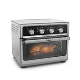 T-fal Easy Fry air fryer; sleek design with four control knobs, a clear viewing window, and a roasted chicken inside.
