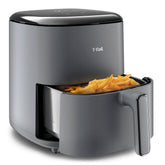 T-fal Easy Fry Max Air Fryer, the front drawer is slightly open, revealing a portion of golden-brown French fries inside the basket.