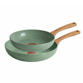 Two green ceramic non-stick frying pans with wood-grain handles, stacked together, shown on a white background.