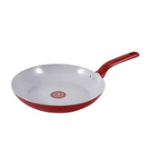 T-fal ceramic nonstick cookware set in red with fry pan, stockpot, and saucepan with glass lids styled in a modern kitchen