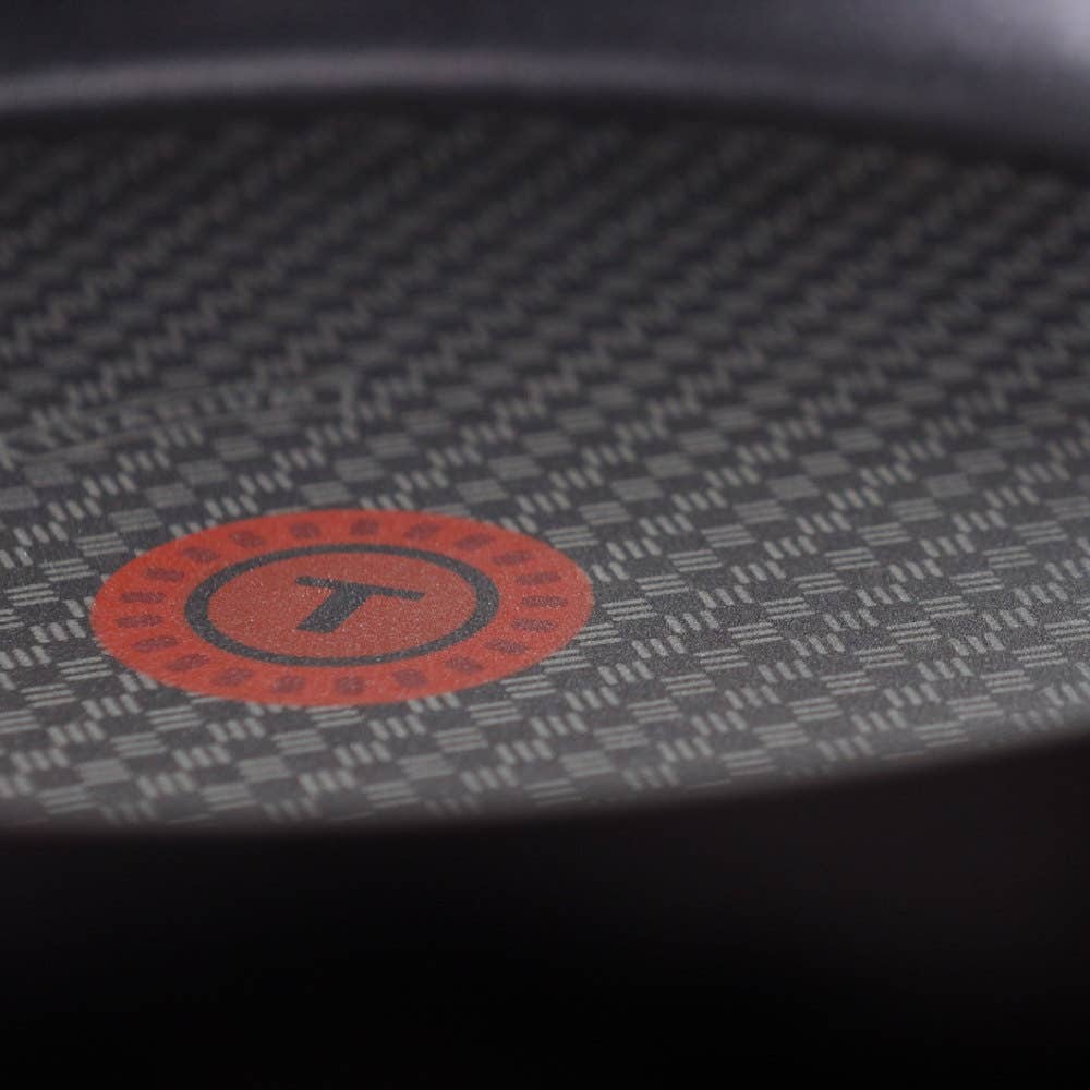 Close-up of pan surface with red T-fal Thermospot.