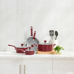 T-fal red cookware set with two frypans, stockpot, saucepan and sauté pan on countertop