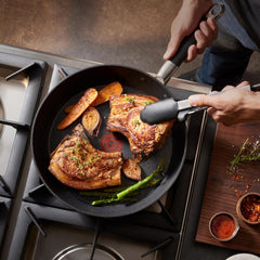 Grilling food in a Stone Force Frying Pan on the stove.