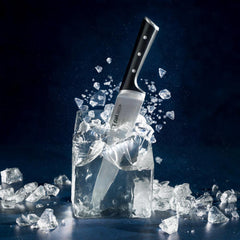 A knife embedded in a shattered block of ice, surrounded by ice fragments.