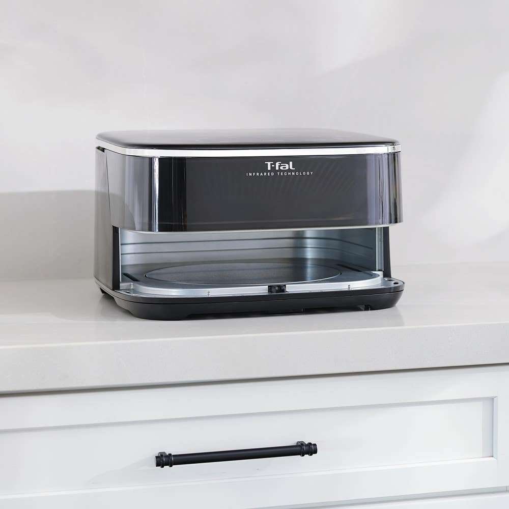 Infrared Surface XXL Air Fryer by T-fal with basket removed, revealing the metal interior and cooking surface inside