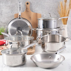 Gourmet stainless steel cookware set displayed on a kitchen counter.