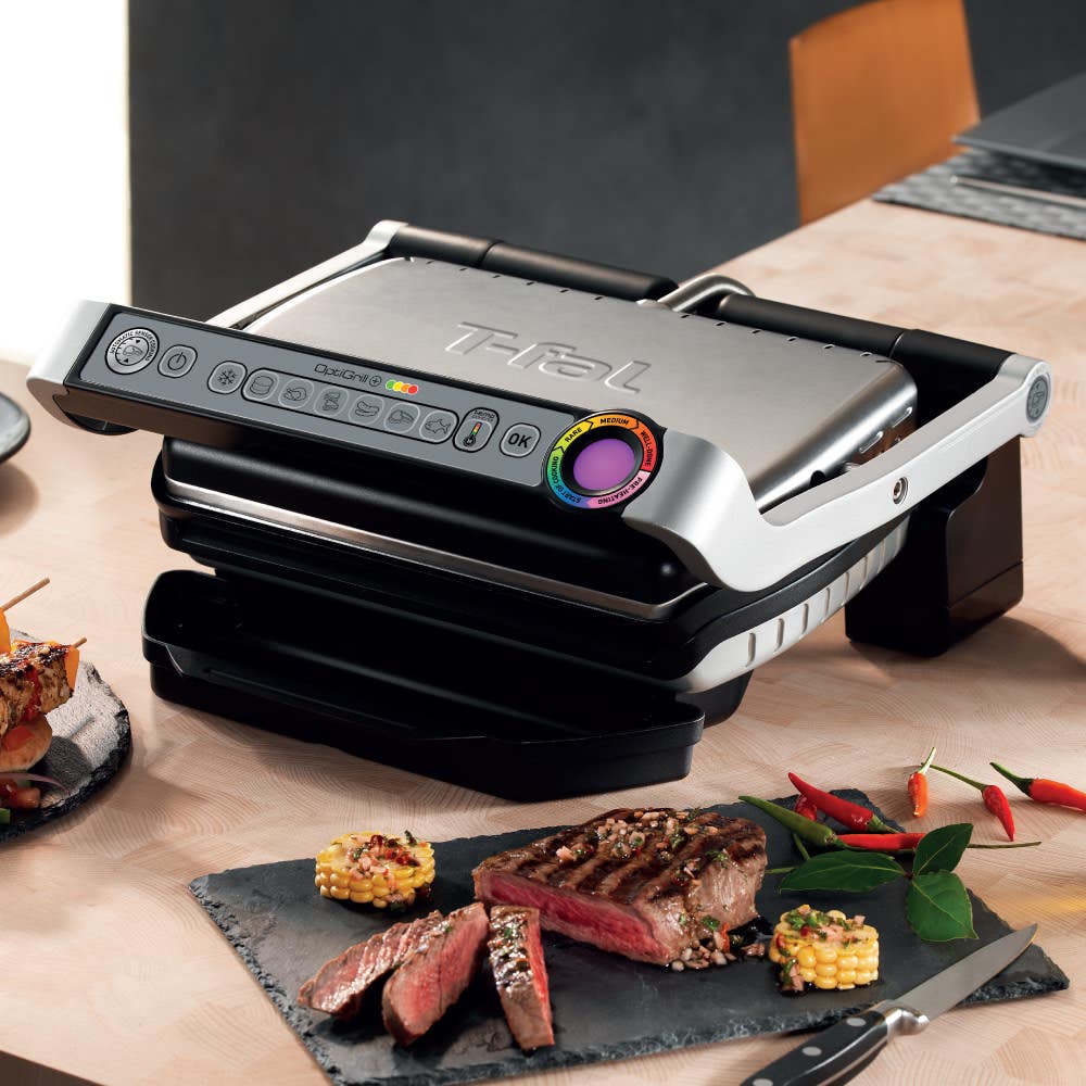 OptiGrill in dinner table alongside cooked steak
