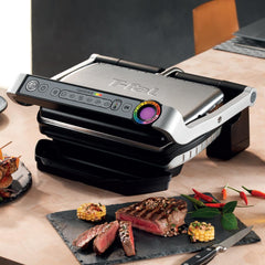 OptiGrill in dinner table alongside cooked steak