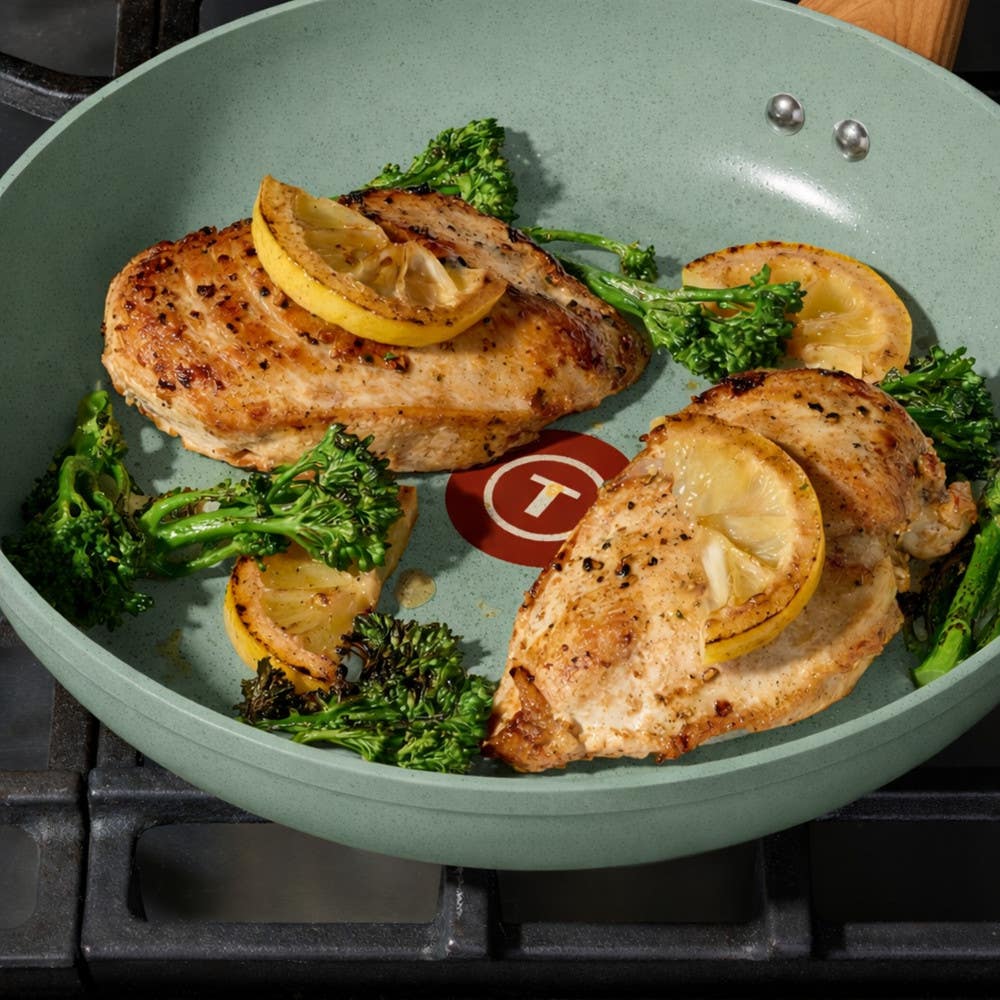 T-fal green ceramic frypan searing chicken with lemon slices and broccolini