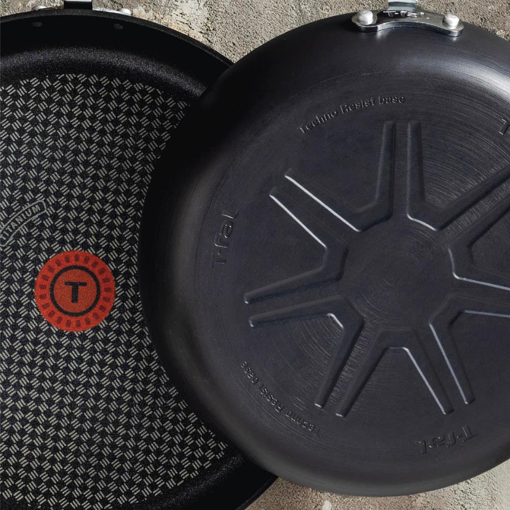 Two frying pans, one flipped to show the bottom.