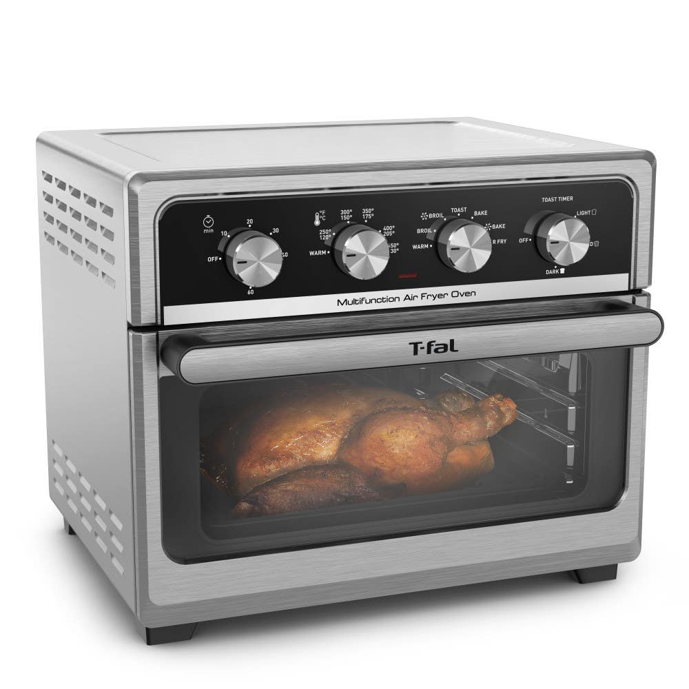 T-fal Easy Fry air fryer; sleek design with four control knobs, a clear viewing window, and a roasted chicken inside.